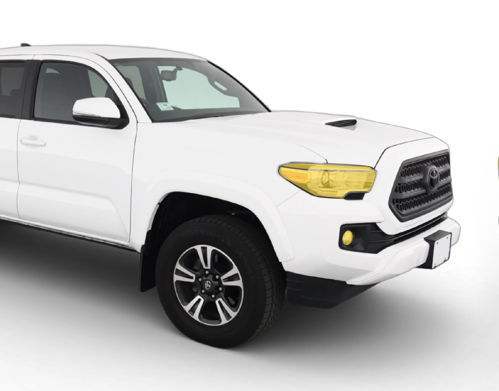 Toyota Tacoma 3rd gen with WildWrap DIY PPF headlights and fog lights coverage shown in yellow overlay
